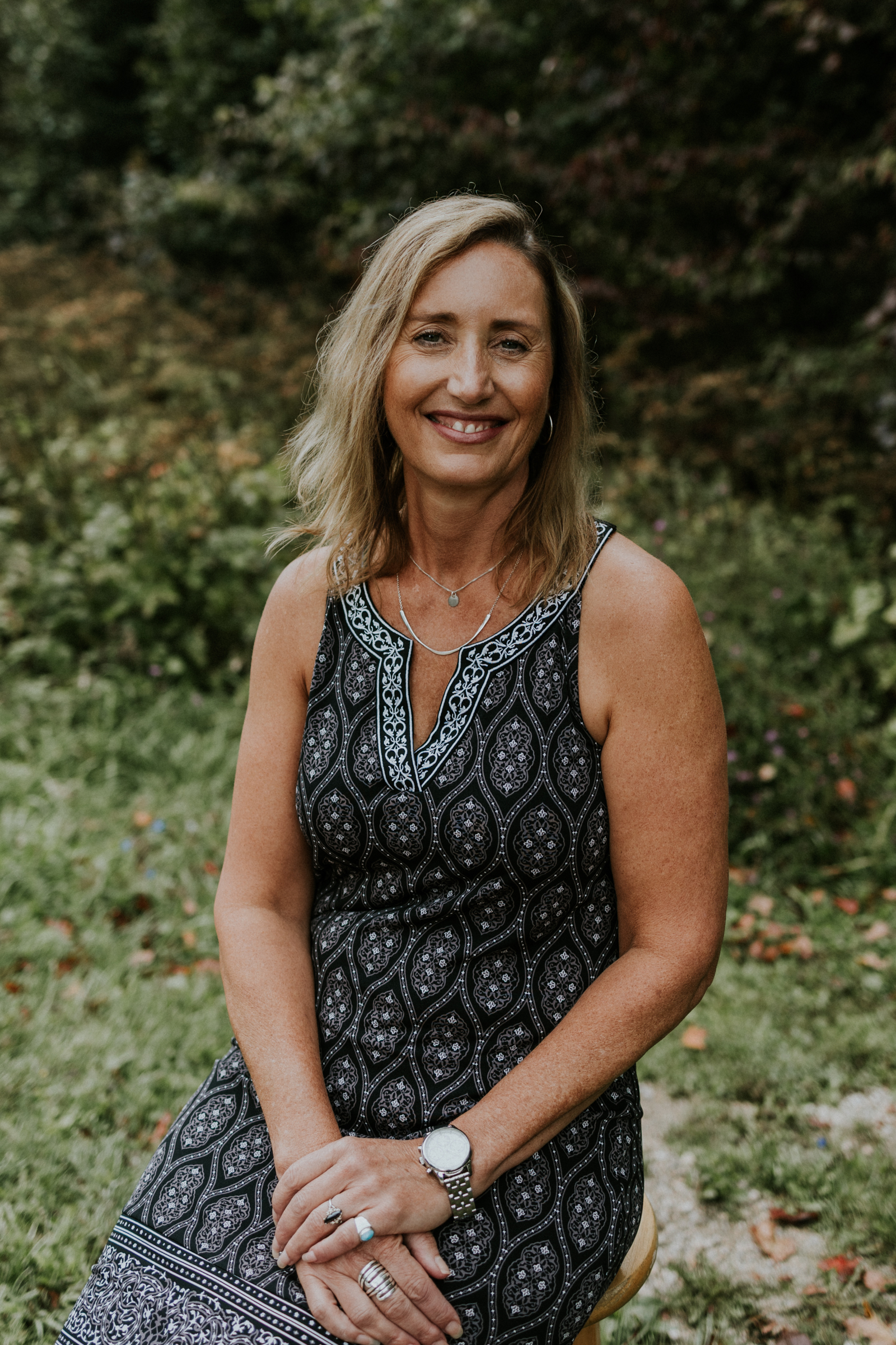 Woman in a grey dress.